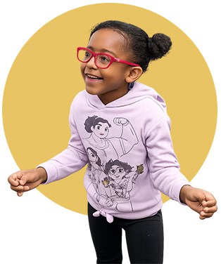 Smiling girl with glasses and hoodie, celebrating success.
