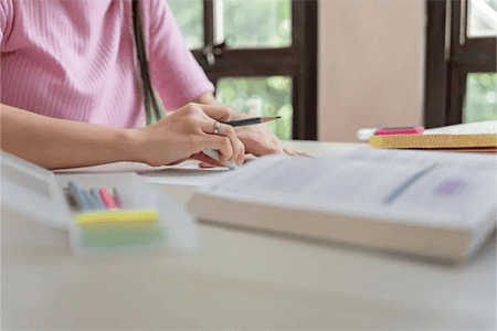Close up of someone using an eraser