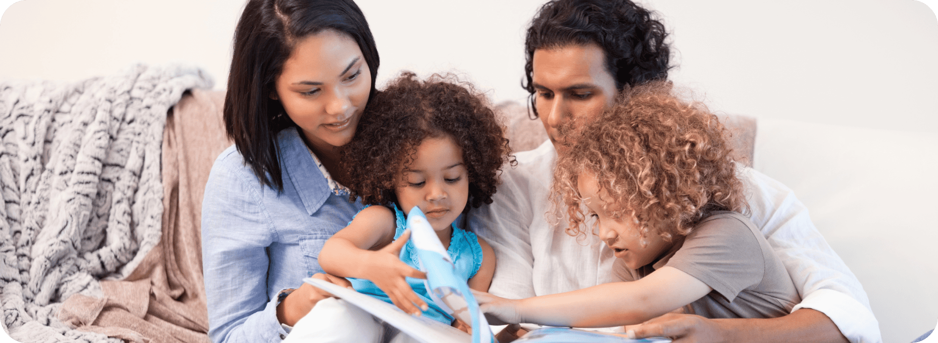 family reading a book together